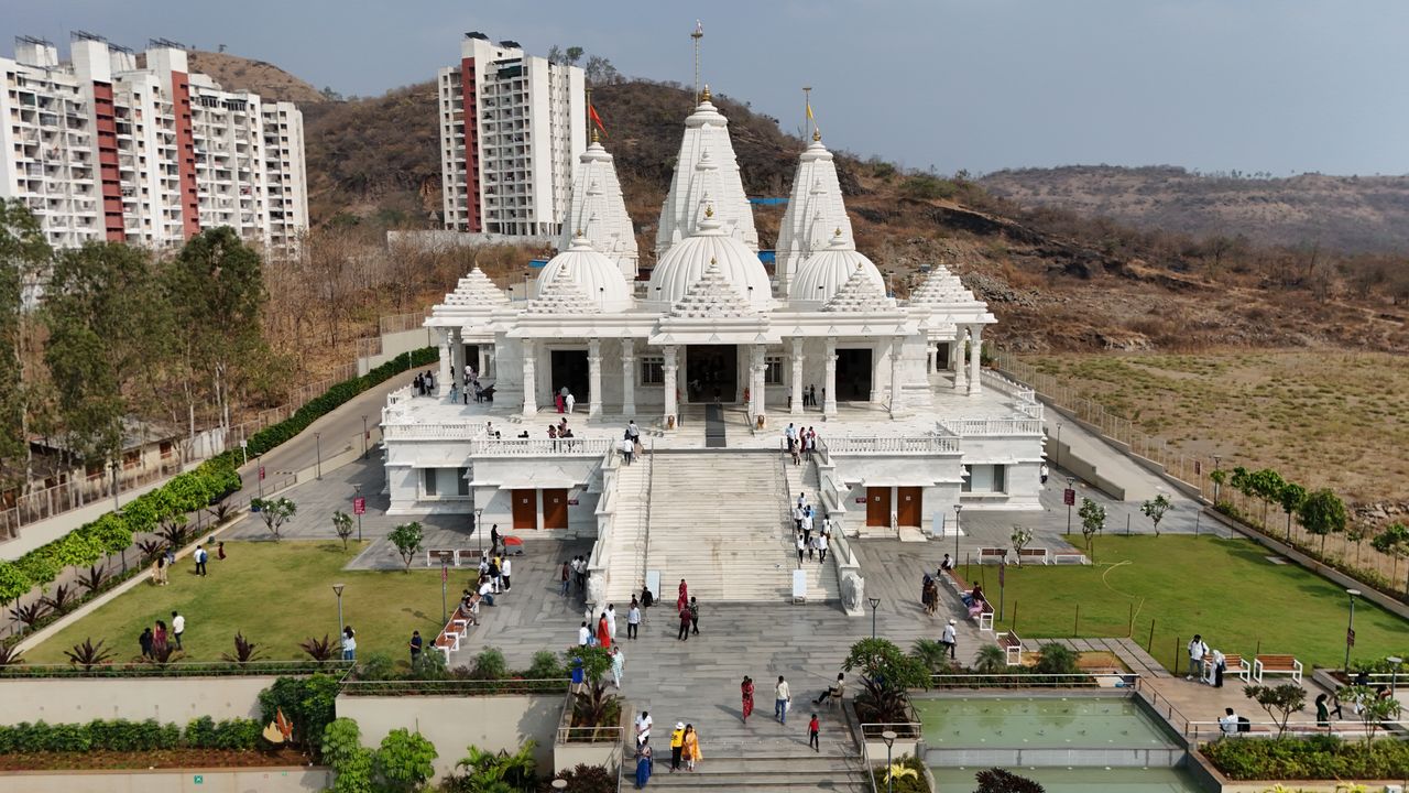 Offerings Aerial shot of a stunning Jain temple surrounded by scenic landscape in Raigad, Maharashtra, India.